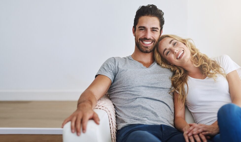 Man and woman on a couch Home Page Hero Image